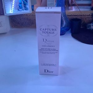 Dior pink 75ml bottle of Dream Skin Care and Perfect